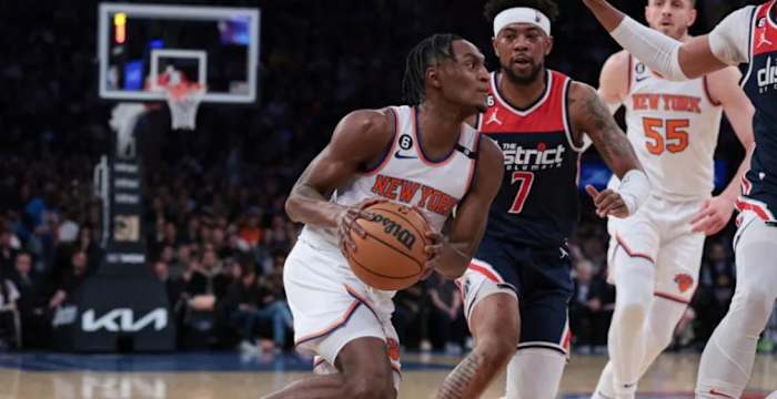 Quickley (center) set career-highs in scoring and rebounding last season